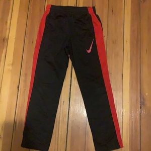 Black and red Nike sweatpants size 7.
